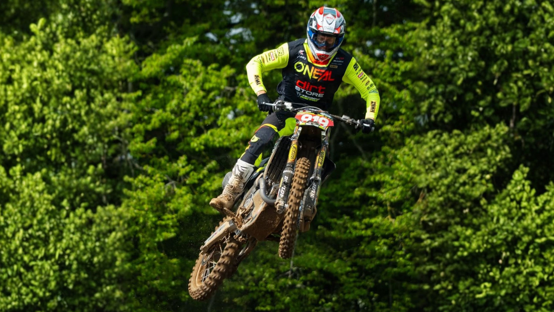 Ben Watson riding his Dirt Store Triumph motocross bike during a jump